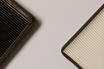 New and old car air filter. Close up.