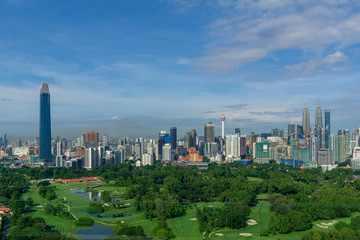 Obraz premium KUALA LUMPUR, MALAYSIA - 11th NOV 2018; Morning view over Kuala Lumpur, capital of Malaysia. Its modern skyline is dominated by the 451m tall KLCC, a pair of glass and steel clad skyscrapers.