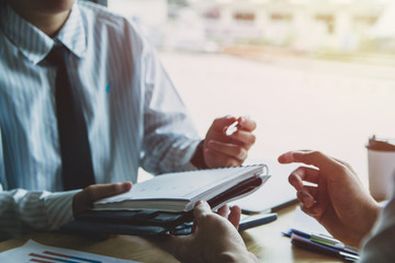 Close-up. Asian business of hand holding pen reviewing and signing,Home buying contract,Selective focus