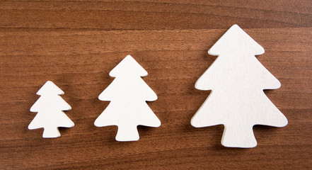 christmas decoration with white trees on a wooden background