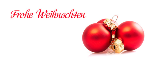red christmas balls with german text Frohe Weihnachten - in english Merry christmas