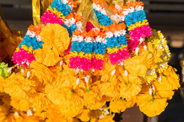 Obraz na płótnie Canvas Colorful marigold flower garlands for the worship of the sacred.