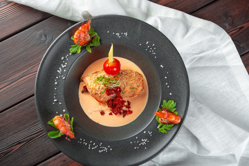 Stuffed squid with parmesan cheese, onion and parsley in tomato sauce