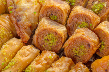 Delicious baklava dessert in oriental bronze setting close up