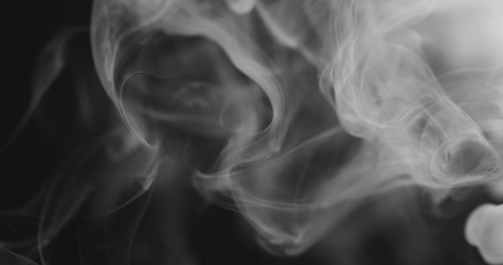 closeup vapor floating in air on black background
