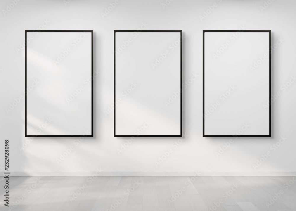 Poster Three frames hanging on a wall mockup 3d rendering