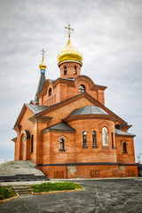 Fototapeta na wymiar Ortodox church in russian city Dudinka, the northernmost international seaport
