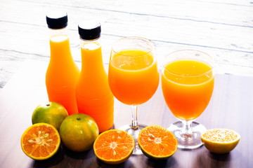 Fresh orange juice and bottled orange