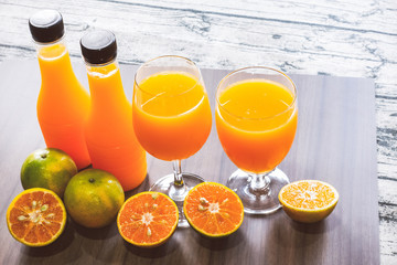 Fresh orange juice and bottled orange
