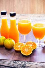 Fresh orange juice and bottled orange