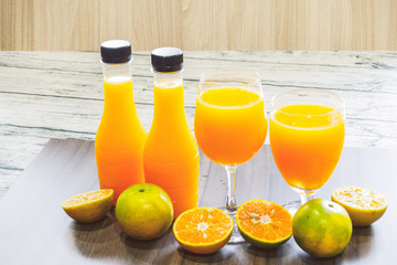 Fresh orange juice and bottled orange