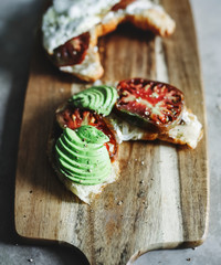 Croissant with heirloom tomato, avocado, and a fried egg