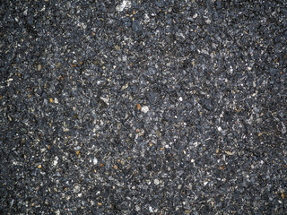 Asphalt texture - road surface background. stone asphalt texture background black granite gravel.