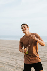 Man drinking a mojito at a beach party