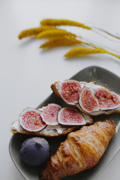 Closeup of croissant with fig