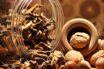 Dried mushrooms spilling from the container. Food ingredients. Forest fruits. Autumn harvest.