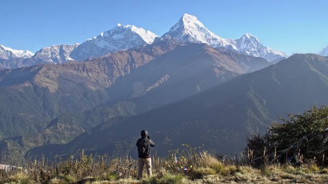 Man Taking Photo of Annapurna Mountain in Nepal. Active Male Tourism. Trekking in the Himalayas