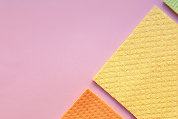 Different napkins for cleaning on color background