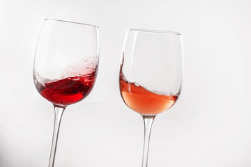 Glasses of different wine on white background