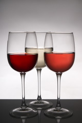 Glasses with different types of wine on table