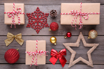 Christmas gifts presents with decorations on a grey background.