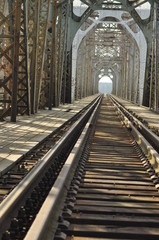 Fototapeta na wymiar Railway bridge. Torah, steel construction. Crossing the river.