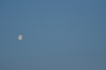 The moon on a clear night. Craters and reflection of sunlight.