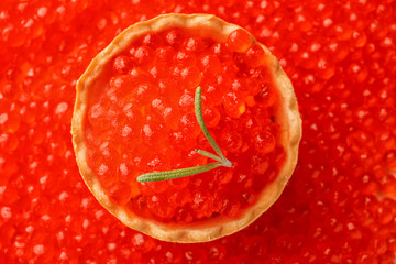 Delicious canape with red caviar, top view