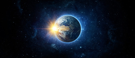 Panoramic view of the Earth, sun, star and galaxy. Sunrise over planet Earth, view from space....