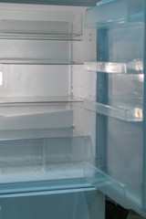 Empty open fridge with shelves, refrigerator.