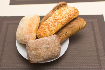 Assortment of baked bread on a plate.
