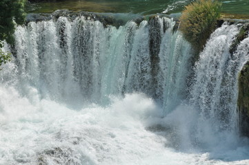 Fototapeta na wymiar Waterfalls in Krka National Park in Croatia. Strength and picturesque miracle of nature