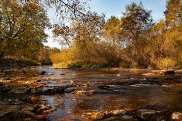Fototapeta premium Above a mountain river on an autumn morning.