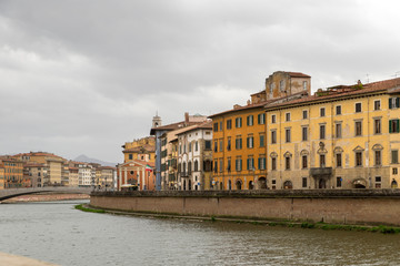 PISA, ITALY - OCTOBER 29, 2018: View of the medieval town of Pisa from bridge "Ponte di Mezzo" on river Arno