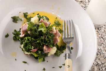 serving a very irish dish colcannon with spring onion, kale, bacon and a glass  milk