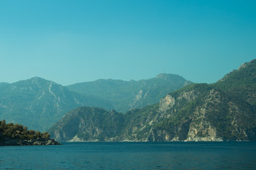 Mountain and sea. coastline with the forest and rock background