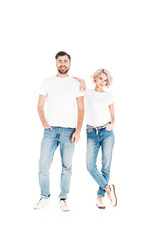 Wonderful smiling couple standing together while woman leaning to man isolated on white