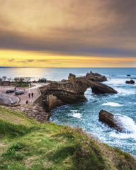 View at sunset towards the Rock of the Blessed Virgin (Rocher de la Vierge) in Biarritz, France - obrazy, fototapety, plakaty