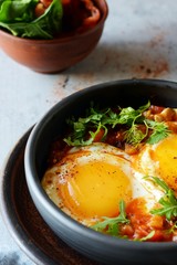 Tasty Shakshuka, Fried Eggs in Tomato Sauce for Easter Brunch. Eggs Poached in Spicy Tomato Pepper Sauce.