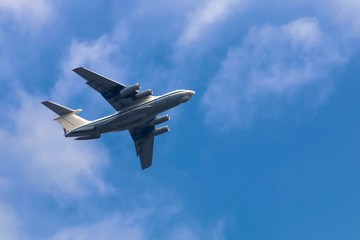 Transport airpcraft flying in the sky. View from the ground