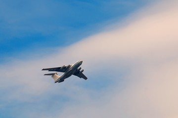 Transport airpcraft flying in the sky. View from the ground