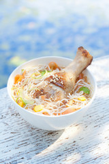Chicken and noodles in bowl, close-up