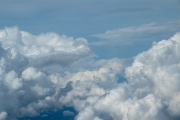 Naklejka na ściany i meble Clouds in the sky from the airplane window.