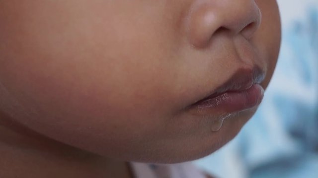 little boy eats candy