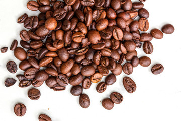 Roasted coffee beans isolated on a white background.