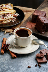 Cup of coffee on grey stone background.