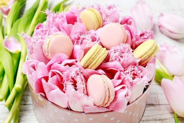 Dotted pink box with tulips and parisian macaroons.