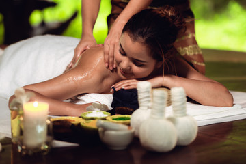Obraz na płótnie Canvas Portrait of Asian woman is relaxing in spa massage, Thai massage