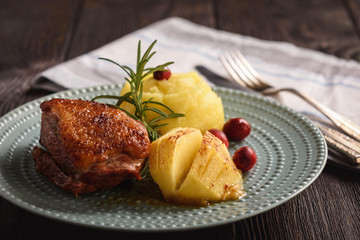 Roasted duck breast with apples and cranberries.
