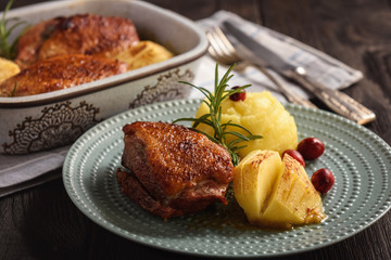 Roasted duck breast with apples and cranberries.
